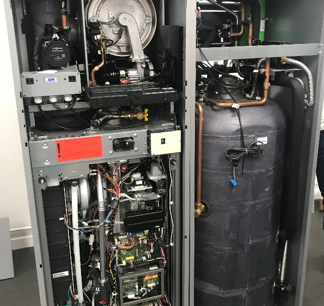 Internal view of heat pump system components installed by The Heating People in Manchester